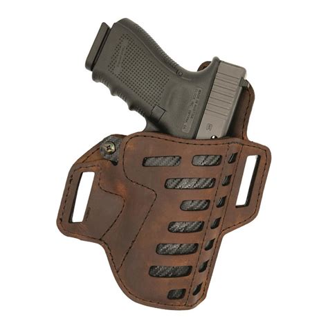 Versacarry holsters - V-Slide (OWB) Holster - Black. The Versacarry V-Slide OWB holster is a hybrid model featuring our signature vegetable-tanned water buffalo leather on the backing, with a carbon fiber textured, custom molded polymer front. This allows for the comfort and natural looks of leather while... 
